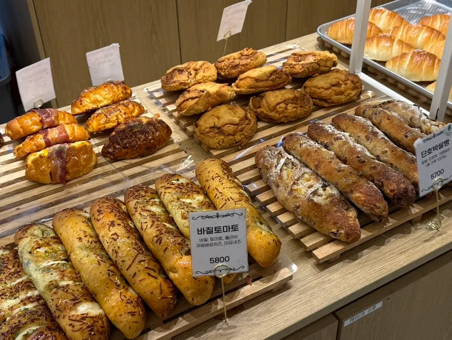 Various kinds of bread on display shelves