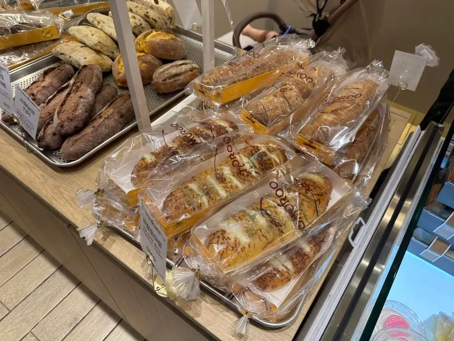 Refrigerated case with strawberry roll cake and sandwiches