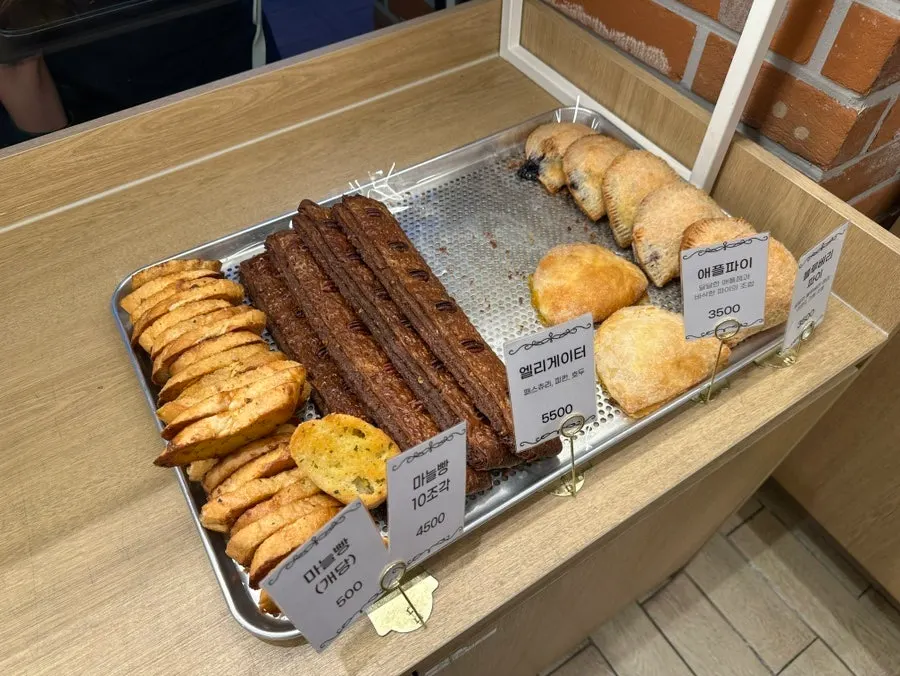 Sweet pumpkin rice bread and a large baguette on the shelf