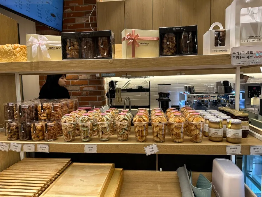 Salt bread, croissant and egg tart display case