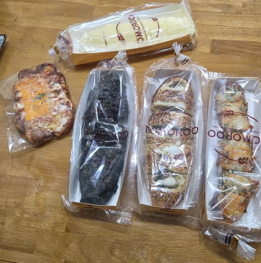 Five breads laid out at home