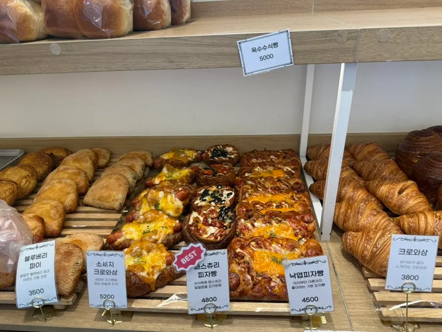 Croissants, mont blanc, and corn panettone displayed