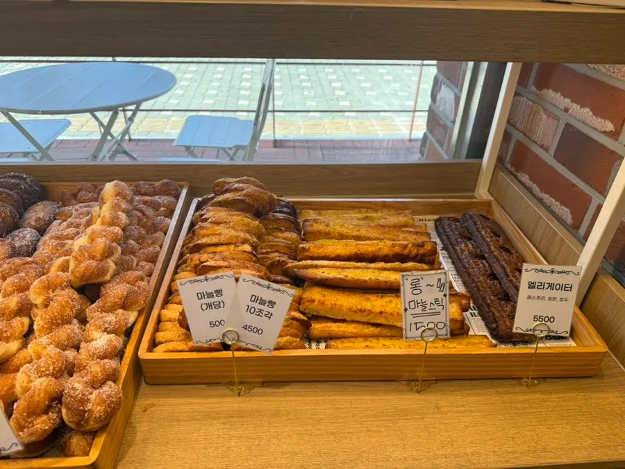 Chestnut bread, pastry twist doughnuts, and fresh doughnuts displayed