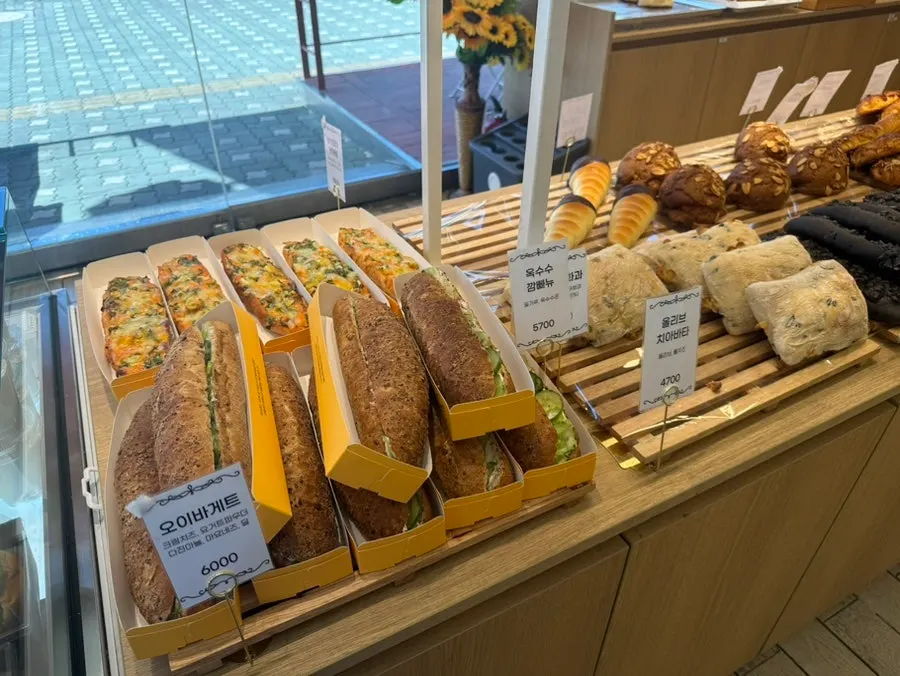BLT, bagel, and mini burger sandwiches displayed