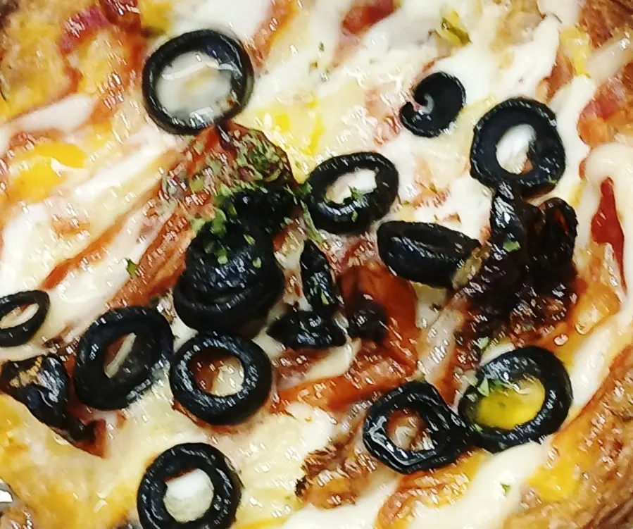 Pastry pizza bread with visible flaky layers