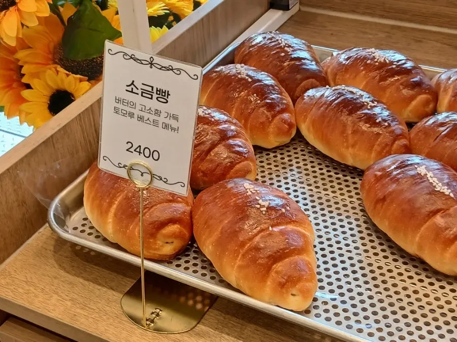 Savory bread display at Tomoru Bakery