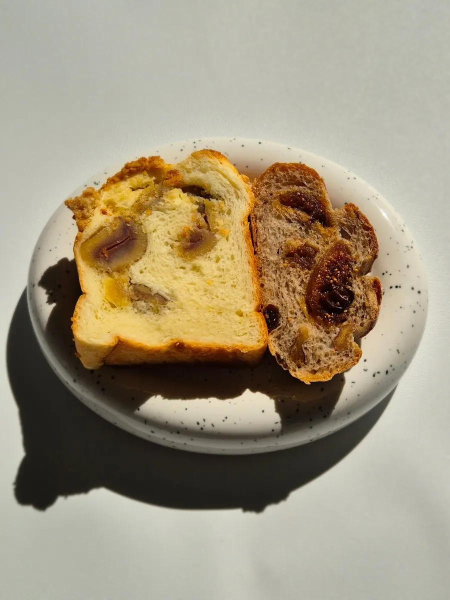 Sliced sweet pumpkin rice bread, olive ciabatta, and kongtteok kongtteok packed to go