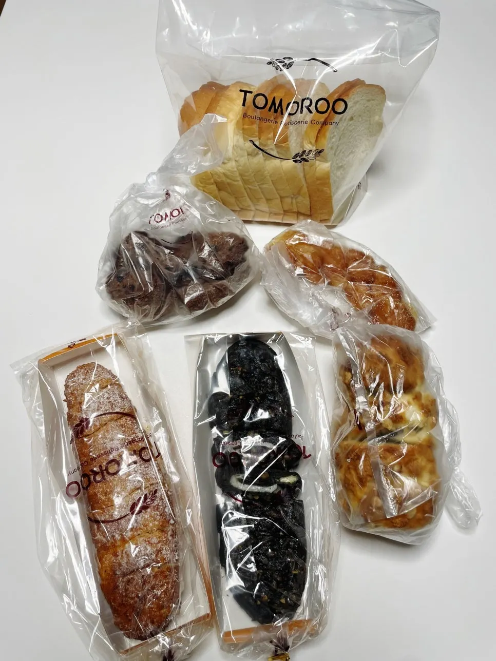 Bags of bread picked out in various kinds from Tomoru Bakery