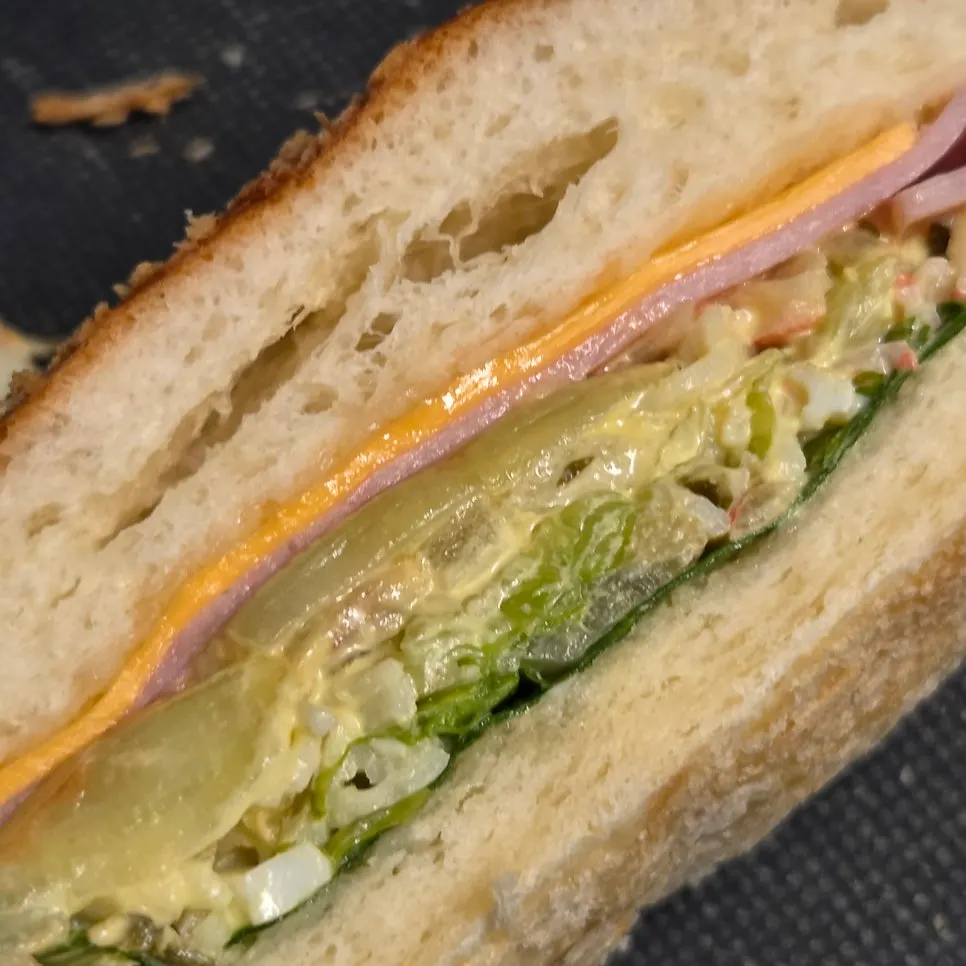 Cross-section of the fresh vegetable croquette showing salad filling