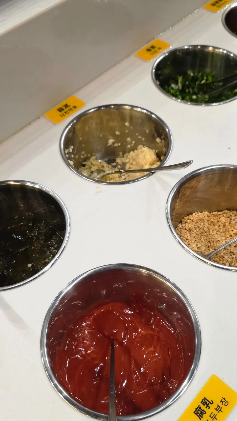 Neatly arranged self-serve bar and sauce bar