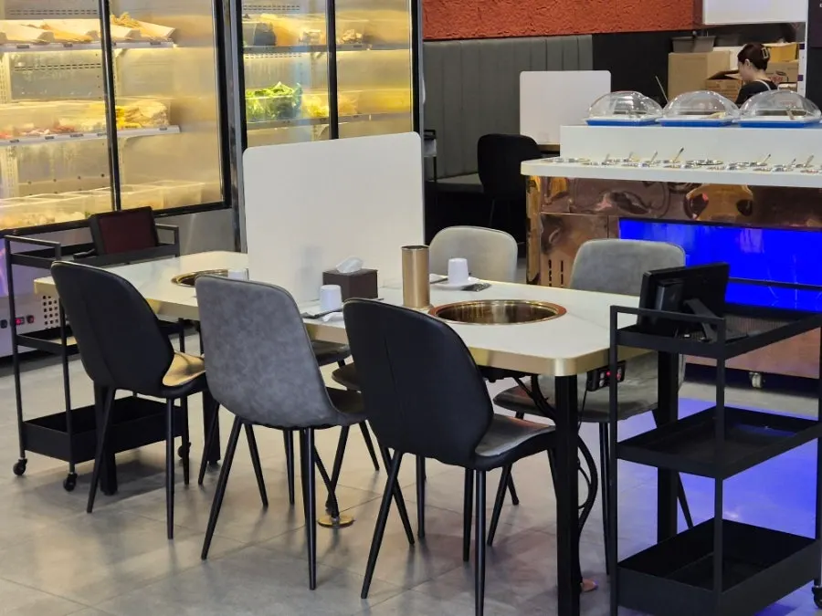 Hot pot restaurant dining hall with wide table spacing