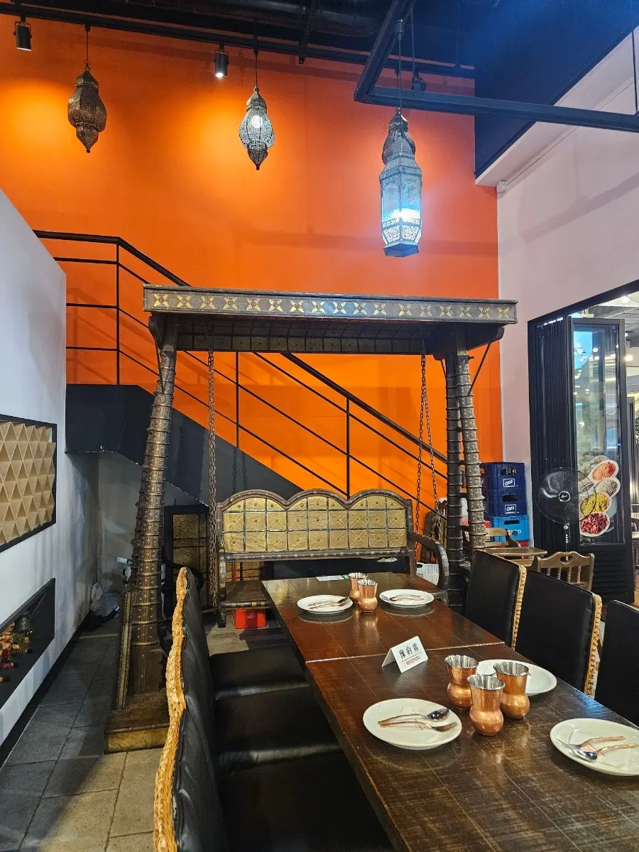 Seating area with Indian-style wall decorations