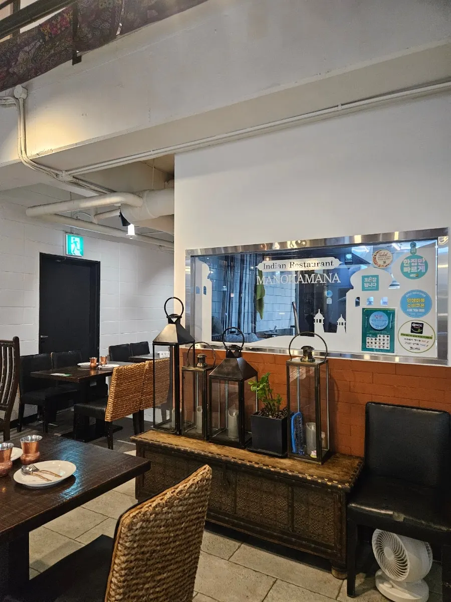 Second-floor seating at Manokamana with a high chair ready