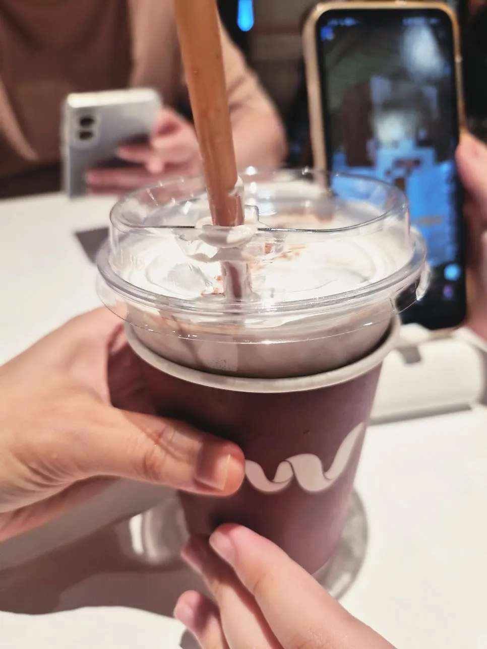 Cream chocolate drink topped with cream