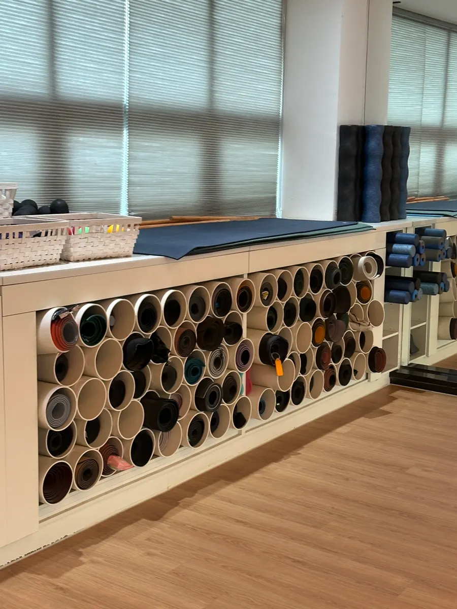 Storage area for personal yoga mats