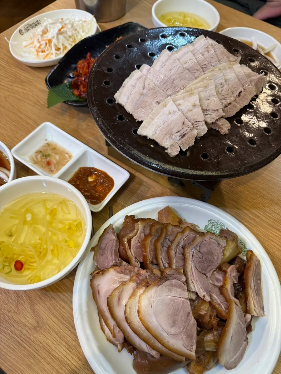 Table spread with the small jokbo set and makguksu