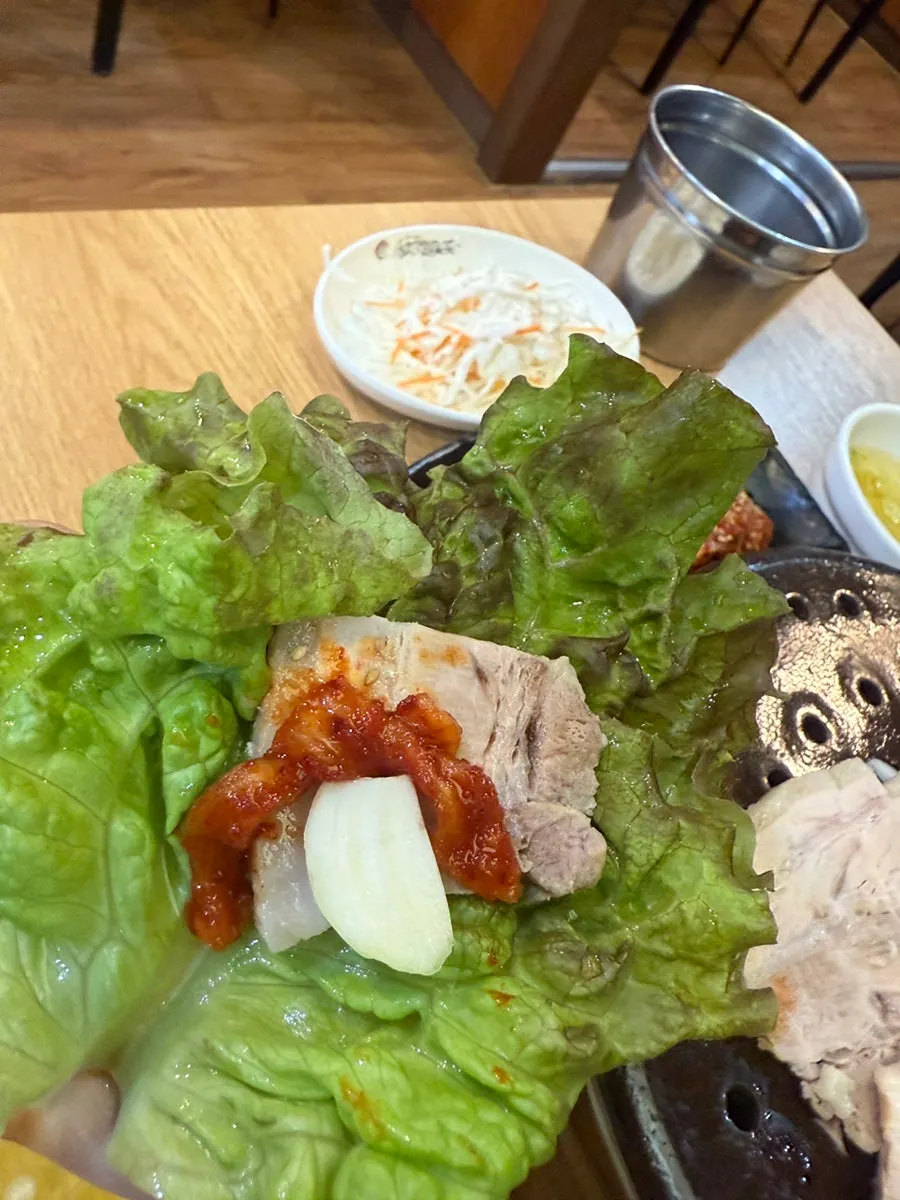 Crisp kimchi served alongside the bossam