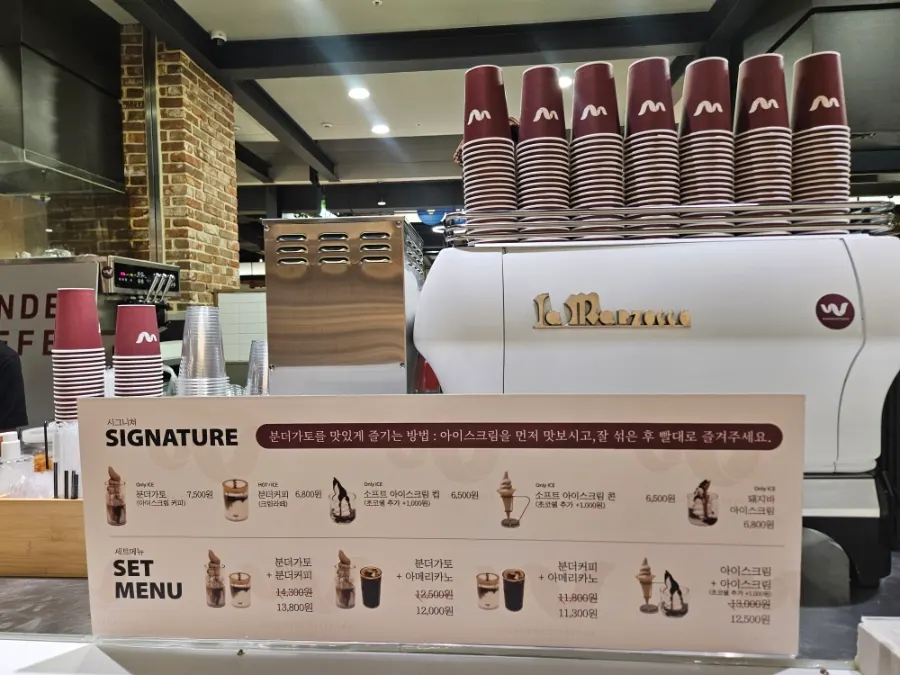 Signature menu sign listing Wunder Gato and Wunder Coffee