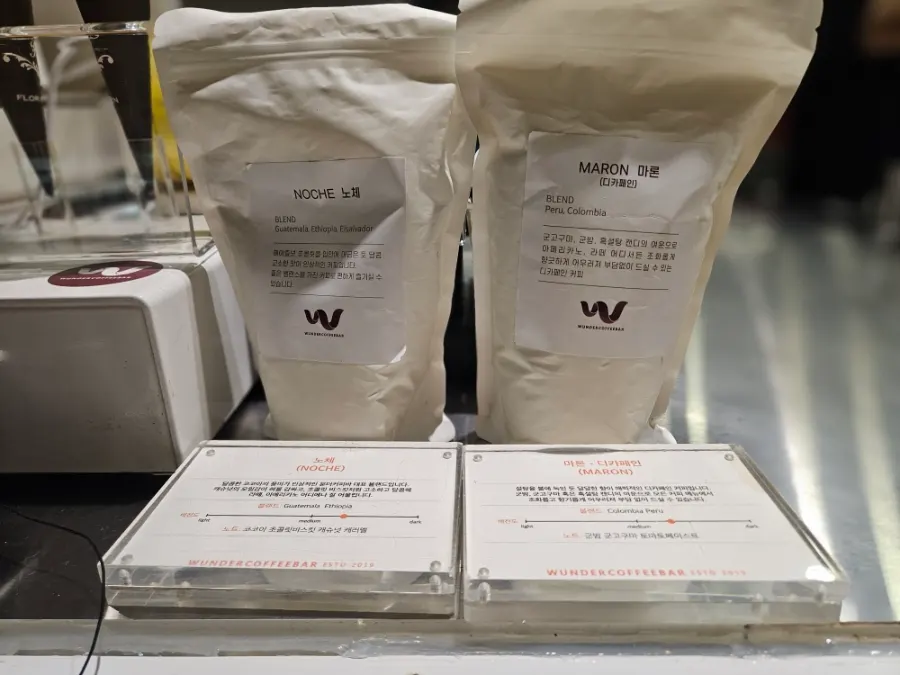 In-house roasted coffee beans on display for sale