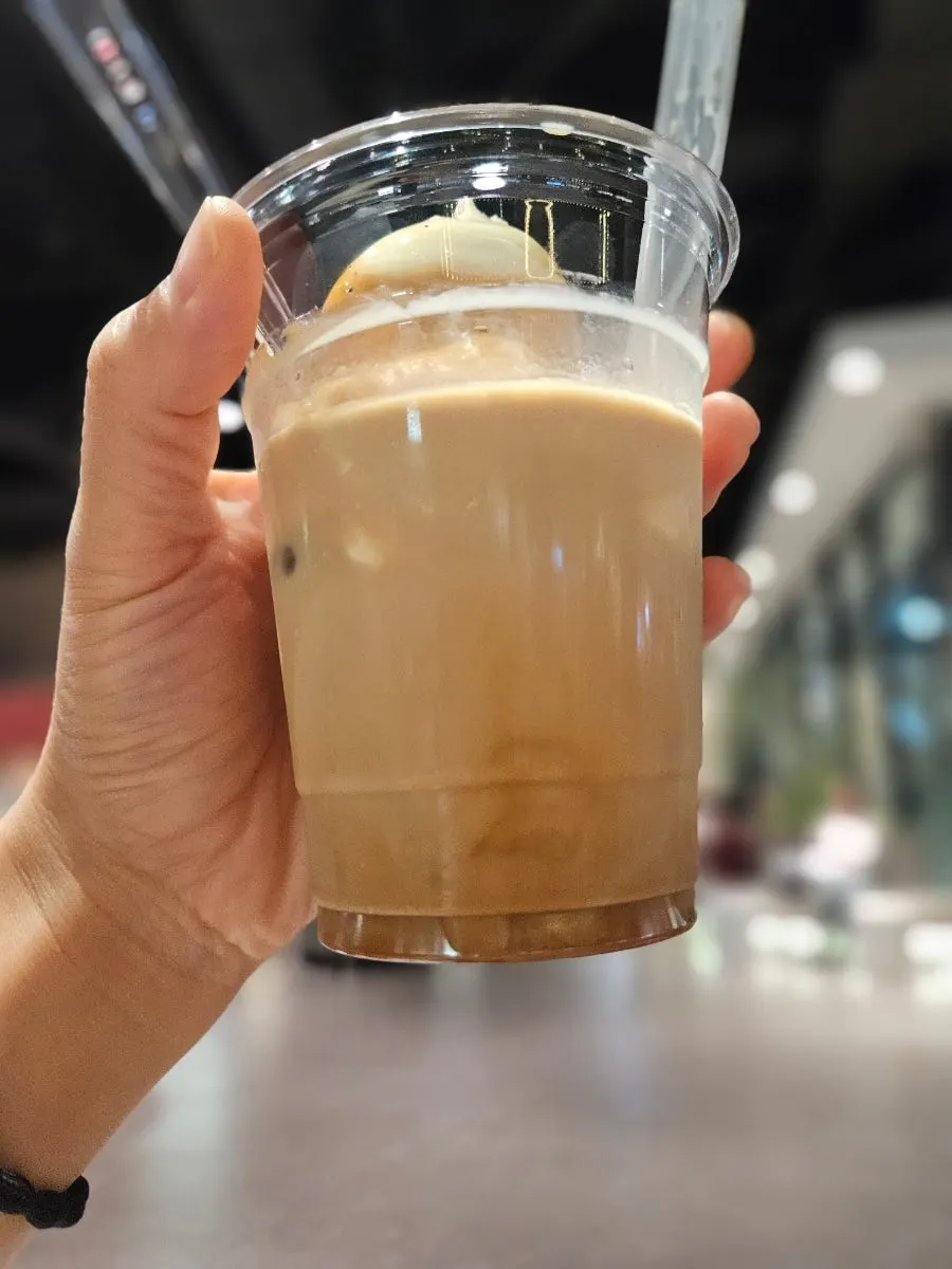 Drinking the Wunder Gato from Wunder Coffee Bar through a straw