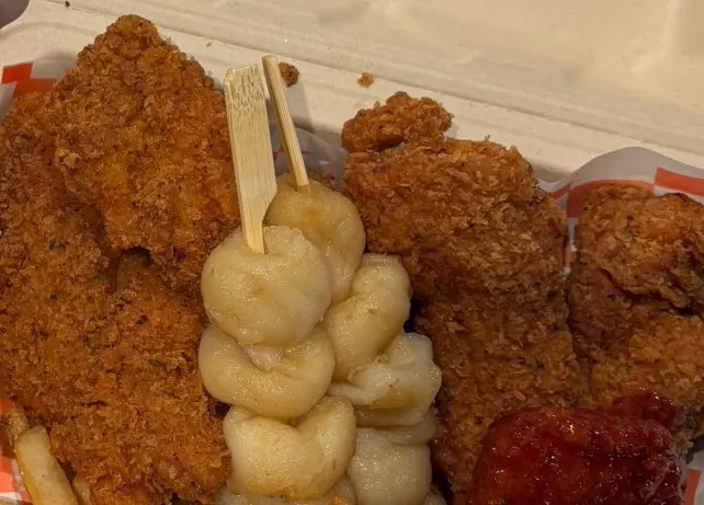 Chewy potato skewers dipped in sauce
