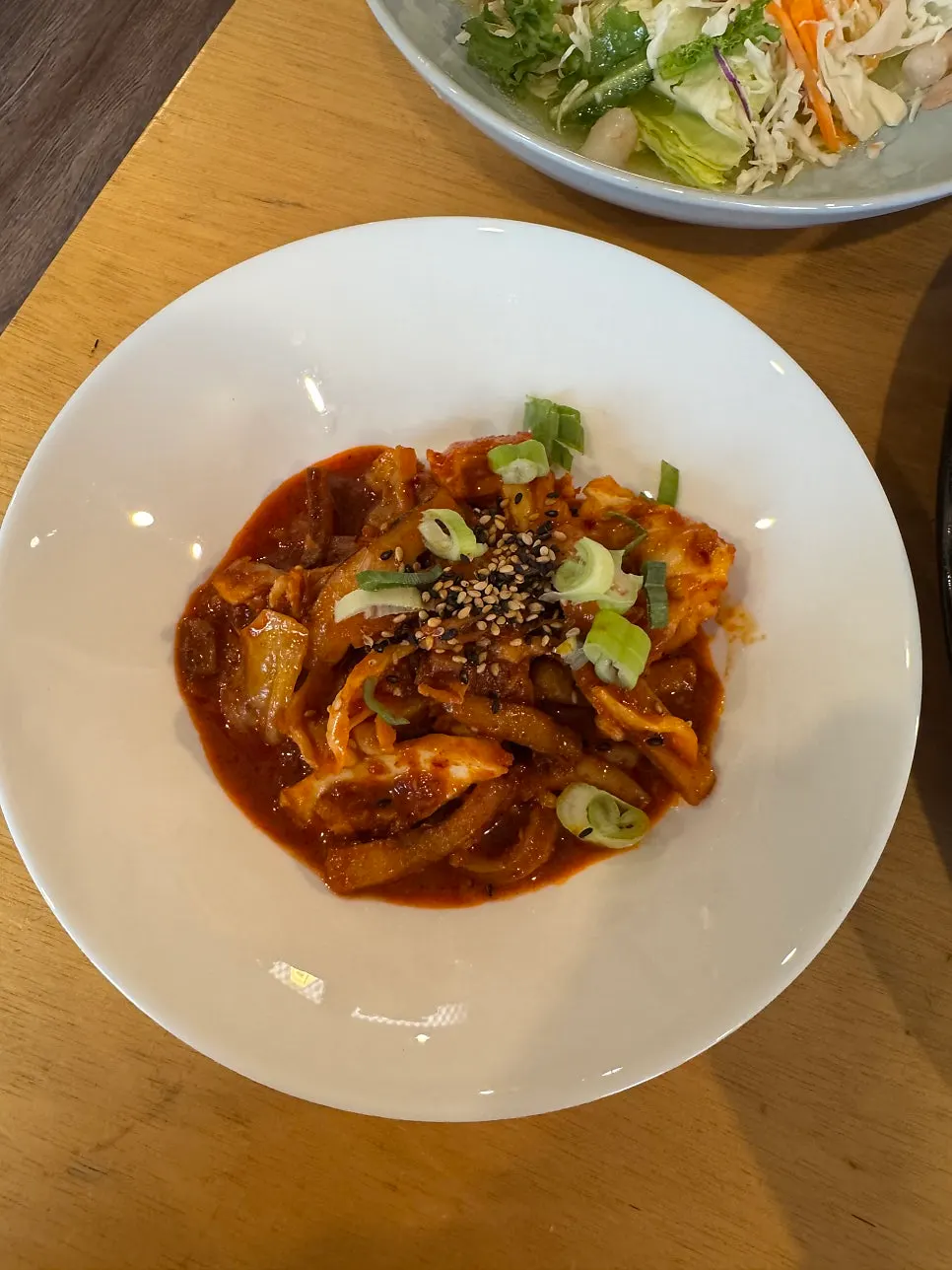 Korean set meal served with lettuce wraps and stir-fried squid
