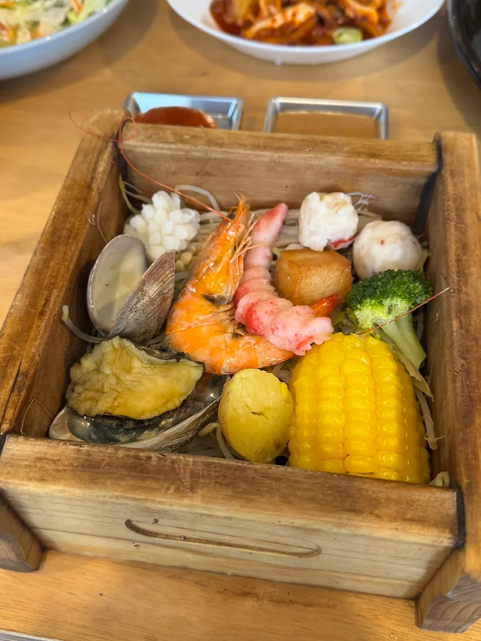 Shrimp, abalone, and clams inside the hinoki steam