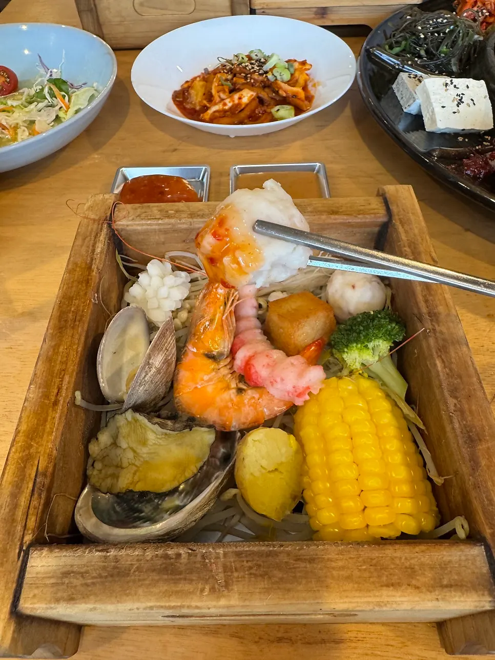 Ingredients inside the seafood hinoki steam infused with cedar aroma