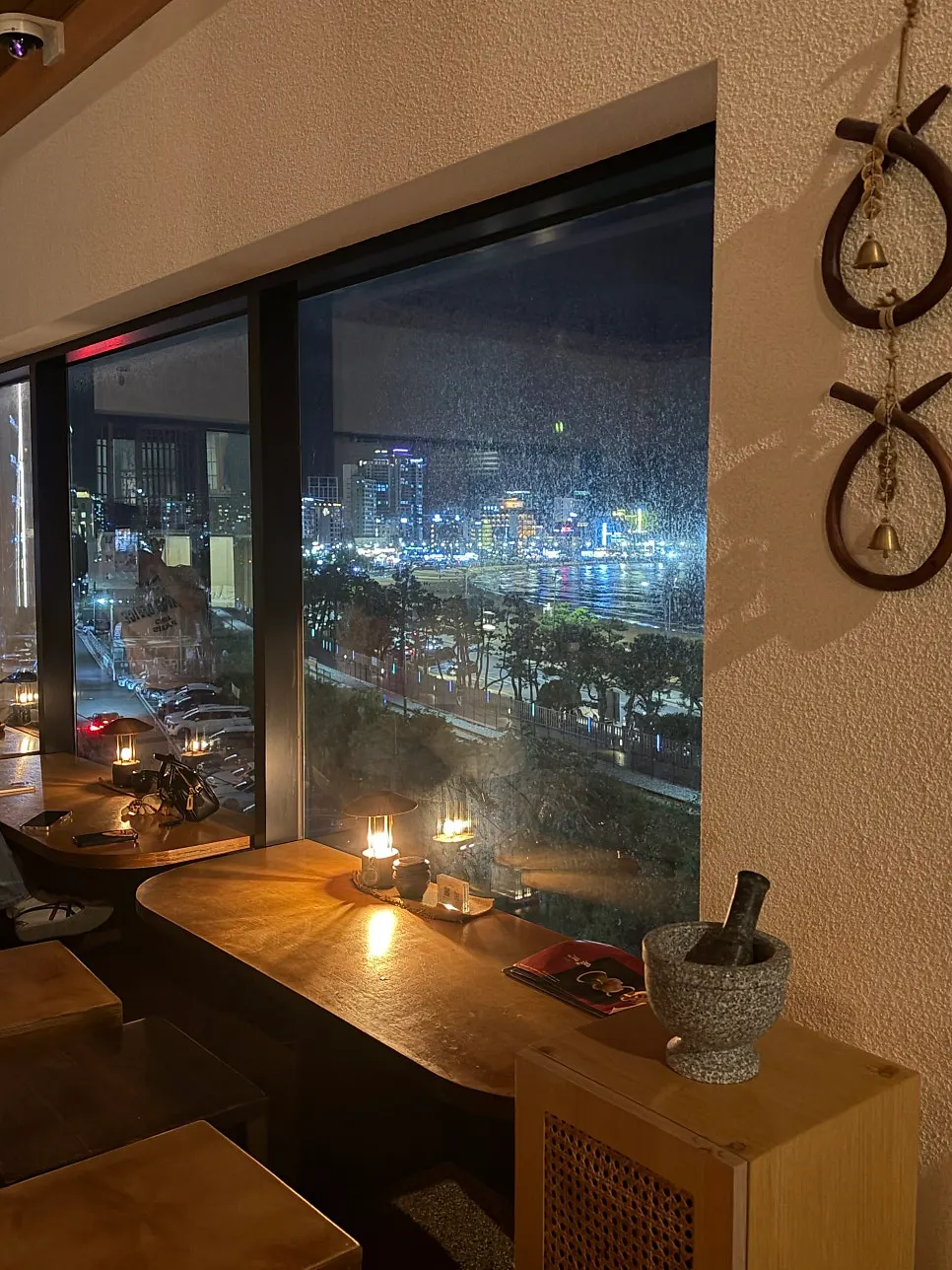 Night view of the sea in front of Songjeong through floor-to-ceiling windows