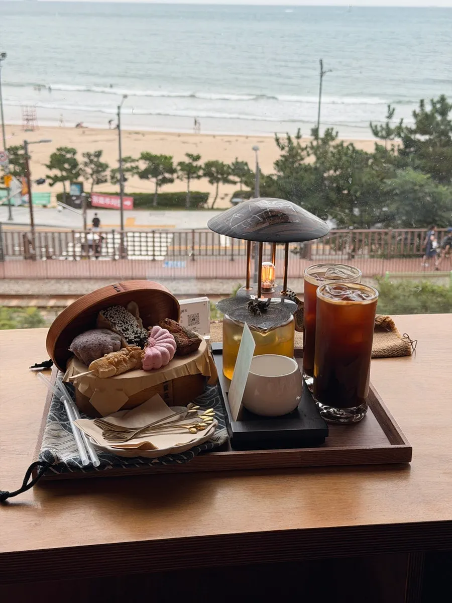 Beach train passing by outside the café window