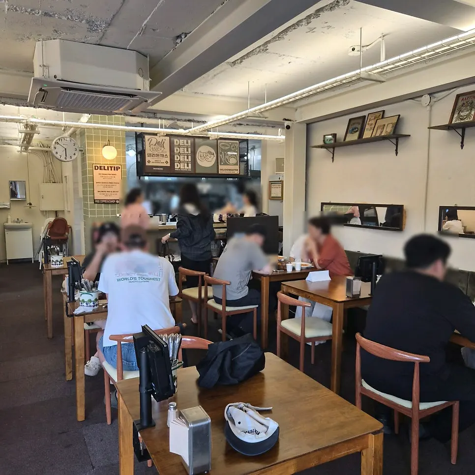 Interior of Deli Donkatsu packed with evening diners
