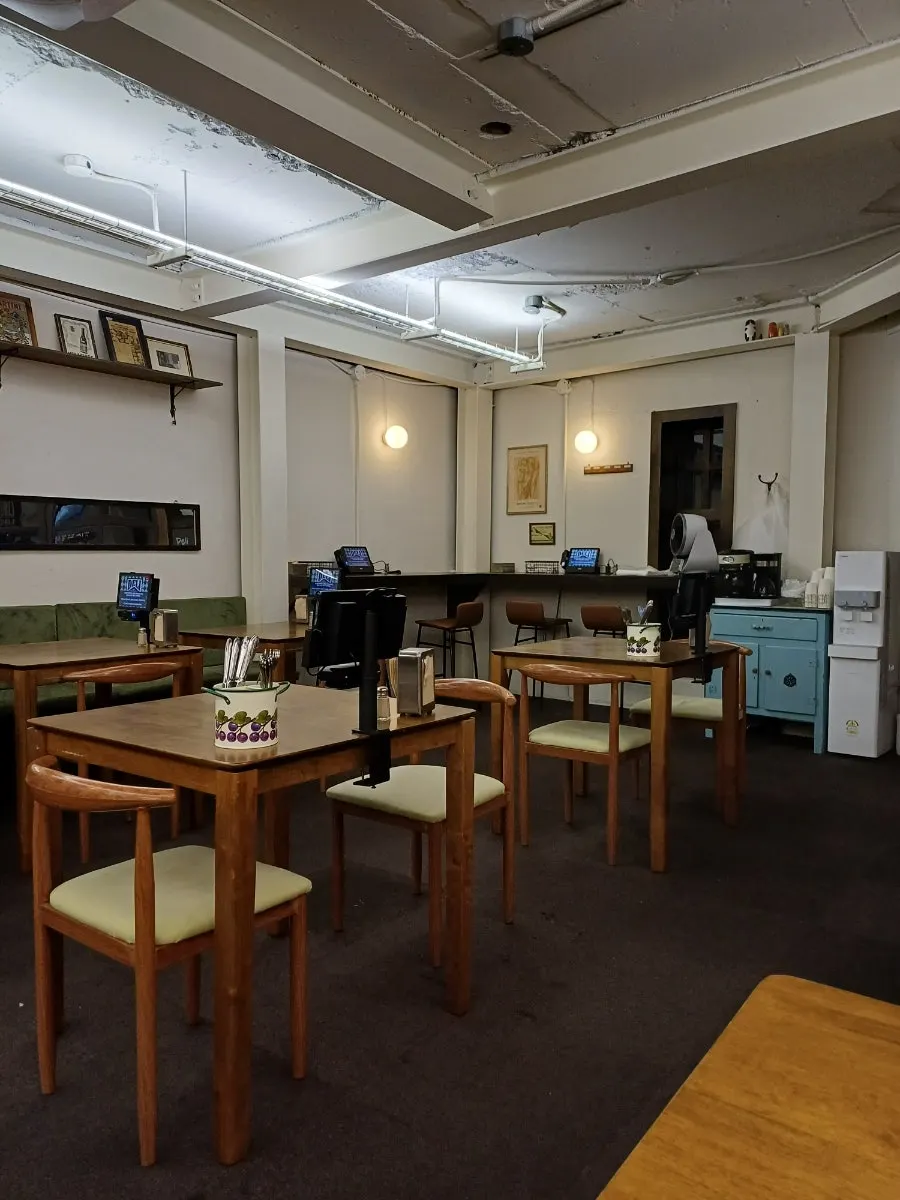 Cozy lit seating area at Deli Donkatsu