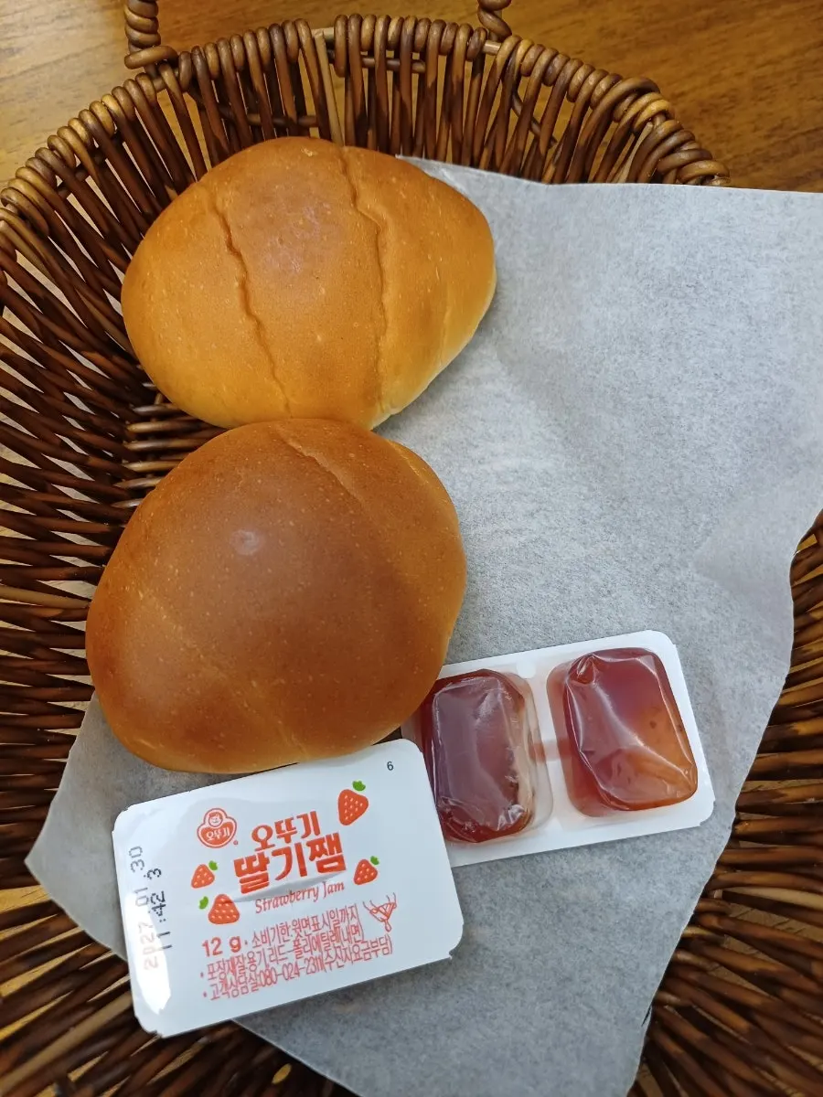 Warm morning roll with strawberry jam