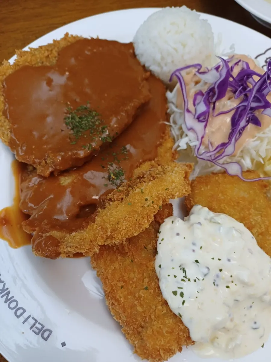 Beef cutlet placed at the top of the assorted platter