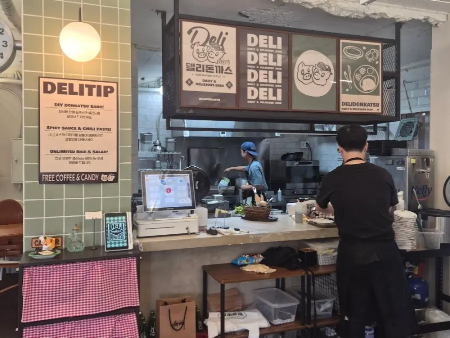 Soft sofa seating at Deli Donkatsu