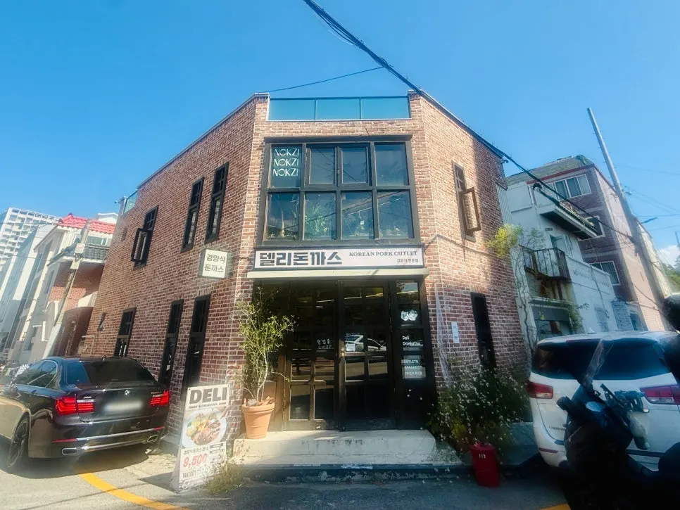 Deli Donkatsu storefront with parking space out front
