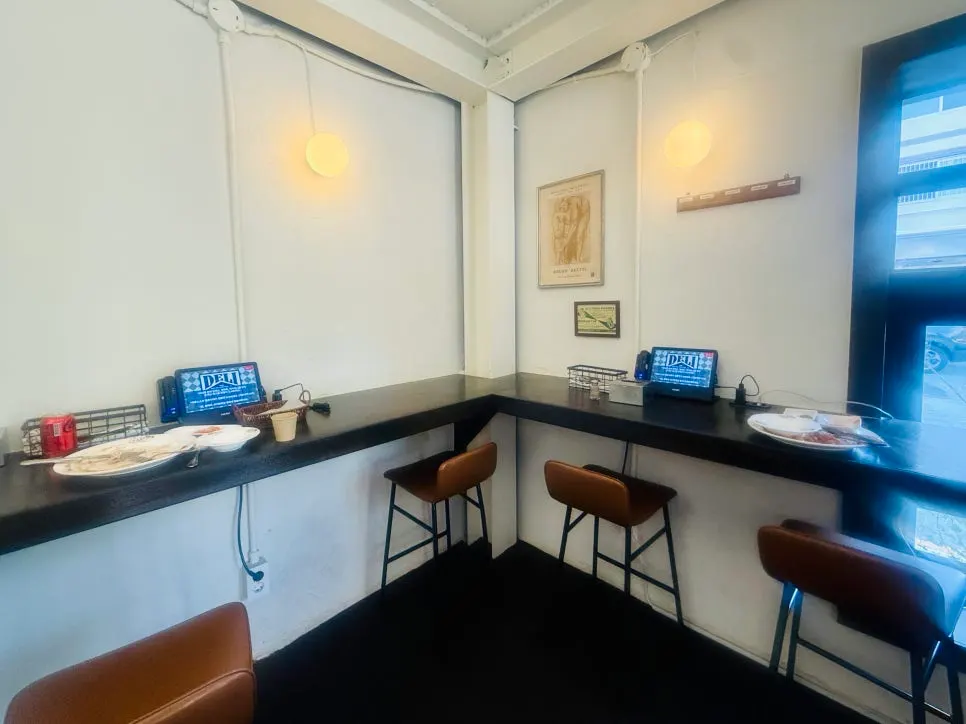 Bar table for solo diners at Deli Donkatsu