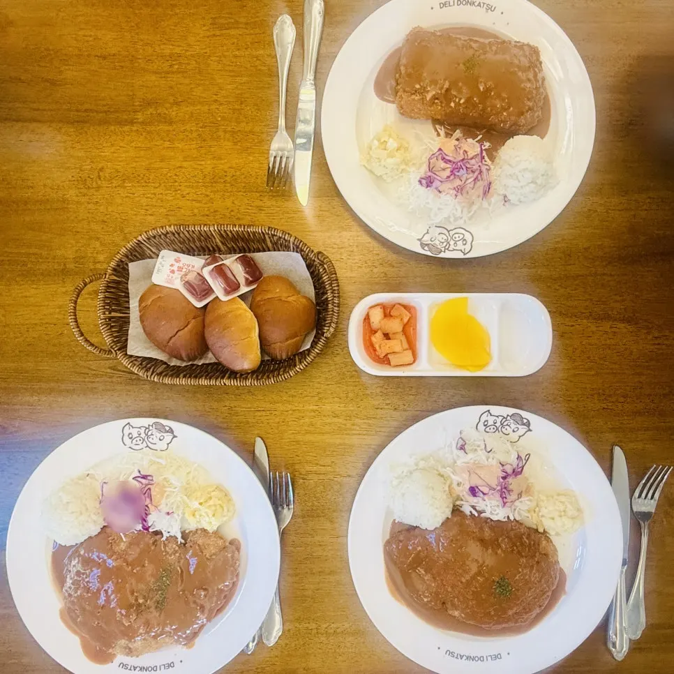 Table quickly set with pork cutlet dishes