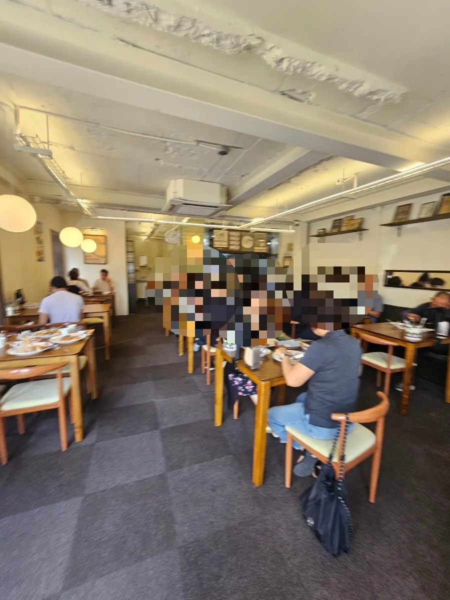 Interior of Deli Donkatsu with customers at 1pm