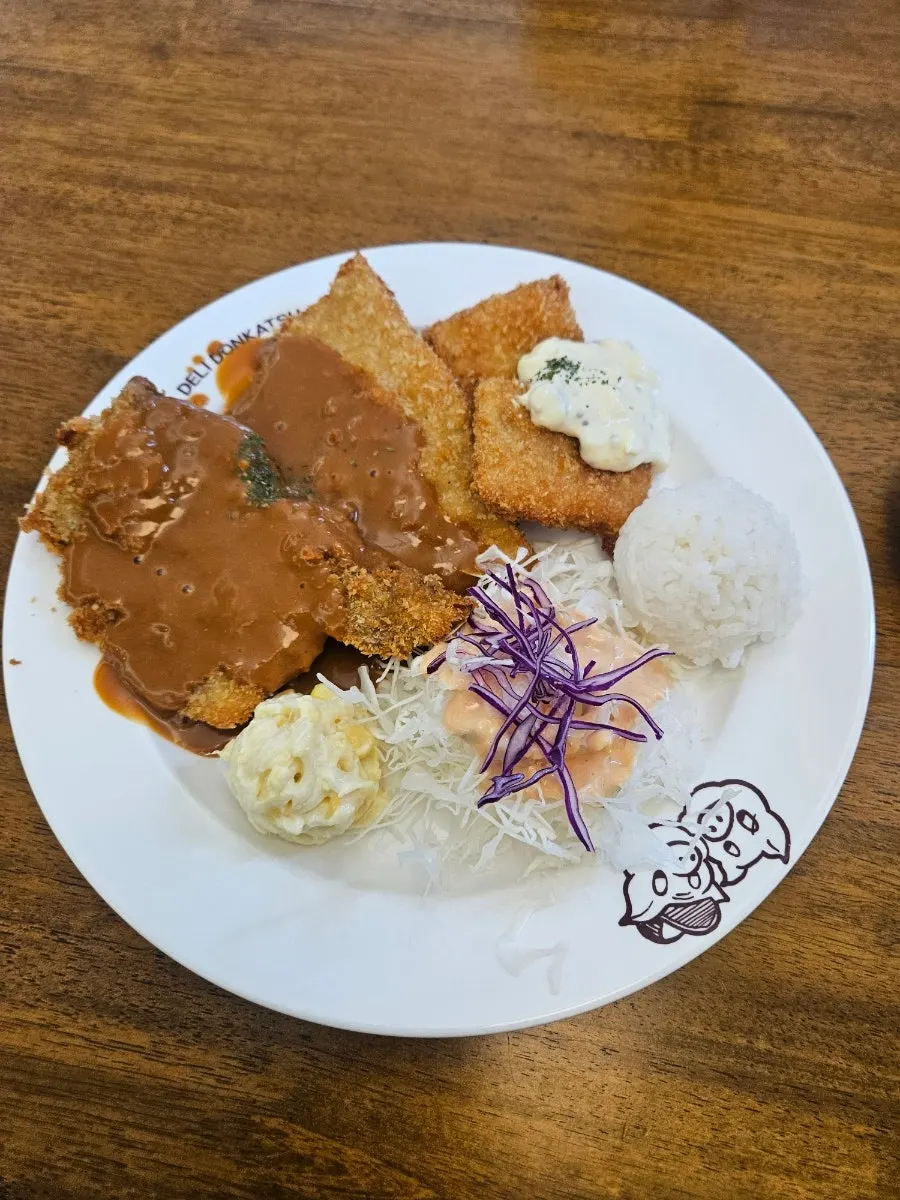 Western-style pork cutlet plated with rice and cabbage salad
