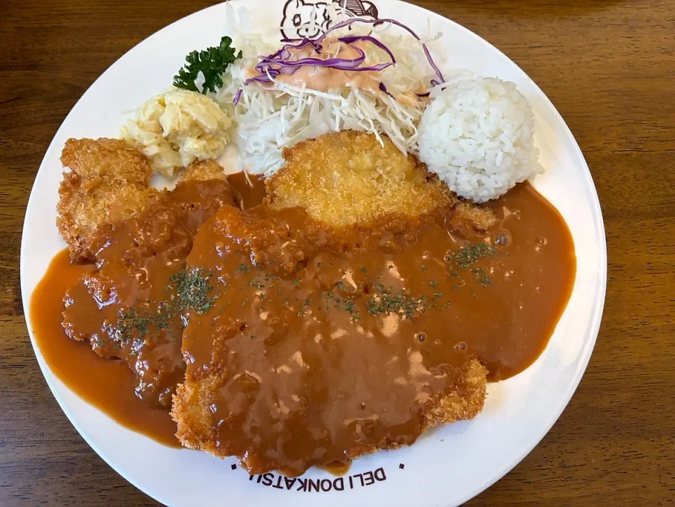 Korean-style pork cutlet set with rice, macaroni, and cabbage salad