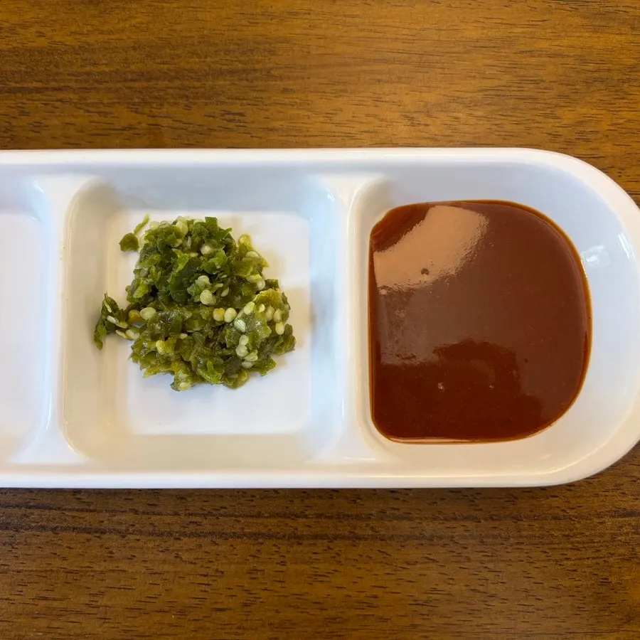 Cutlet with spicy sauce and chili relish on top