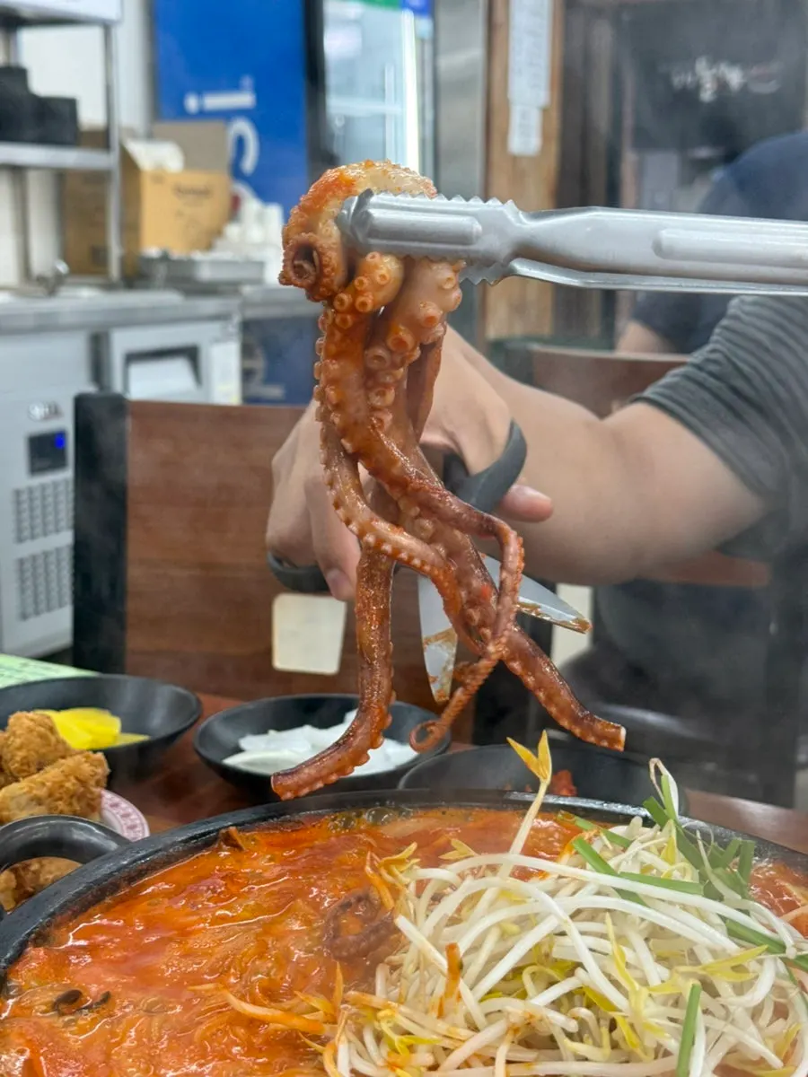 Dol jjamppong topped with a whole octopus