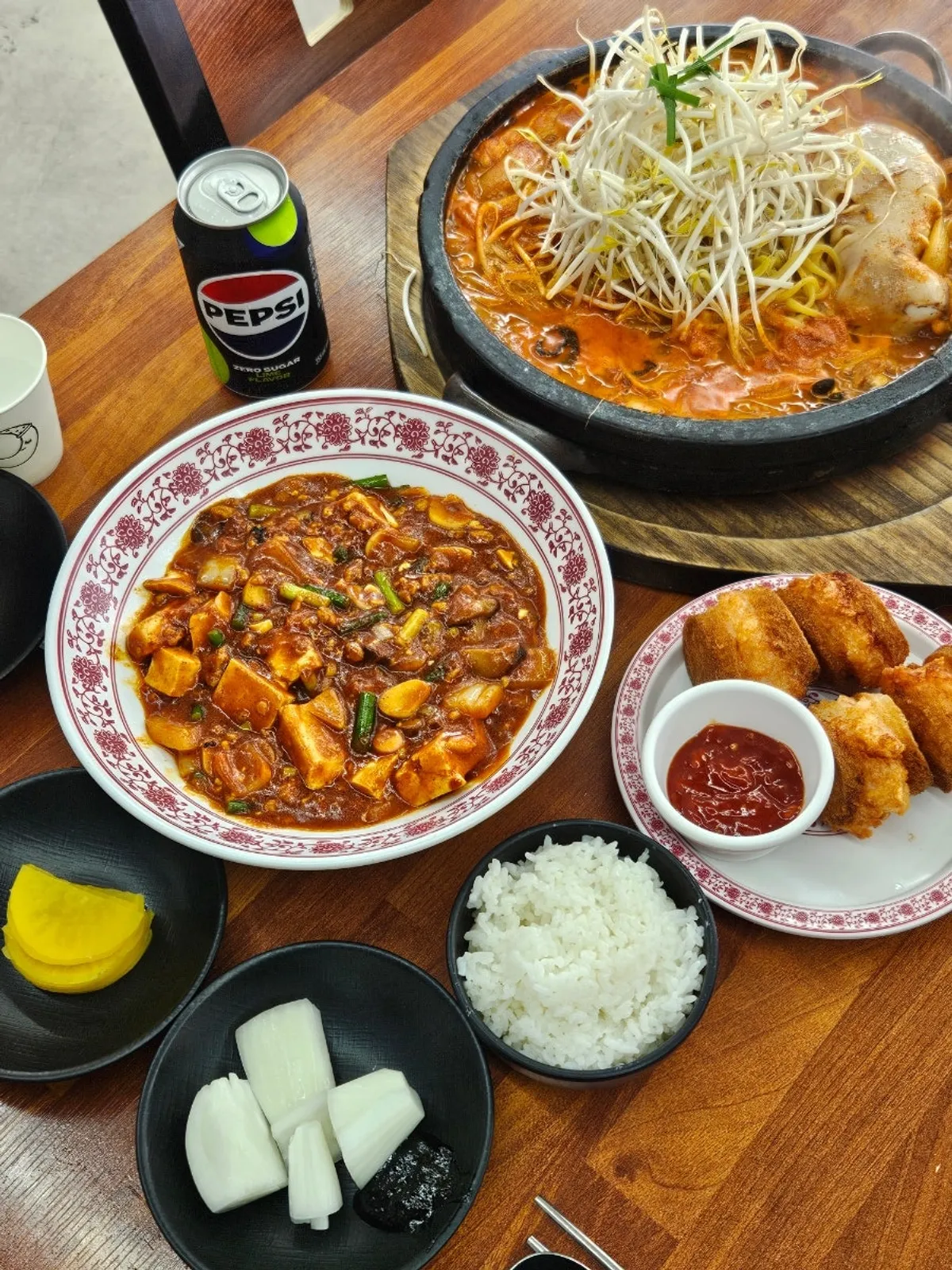 Table set with stone-plate jjamppong and mapa tofu rice