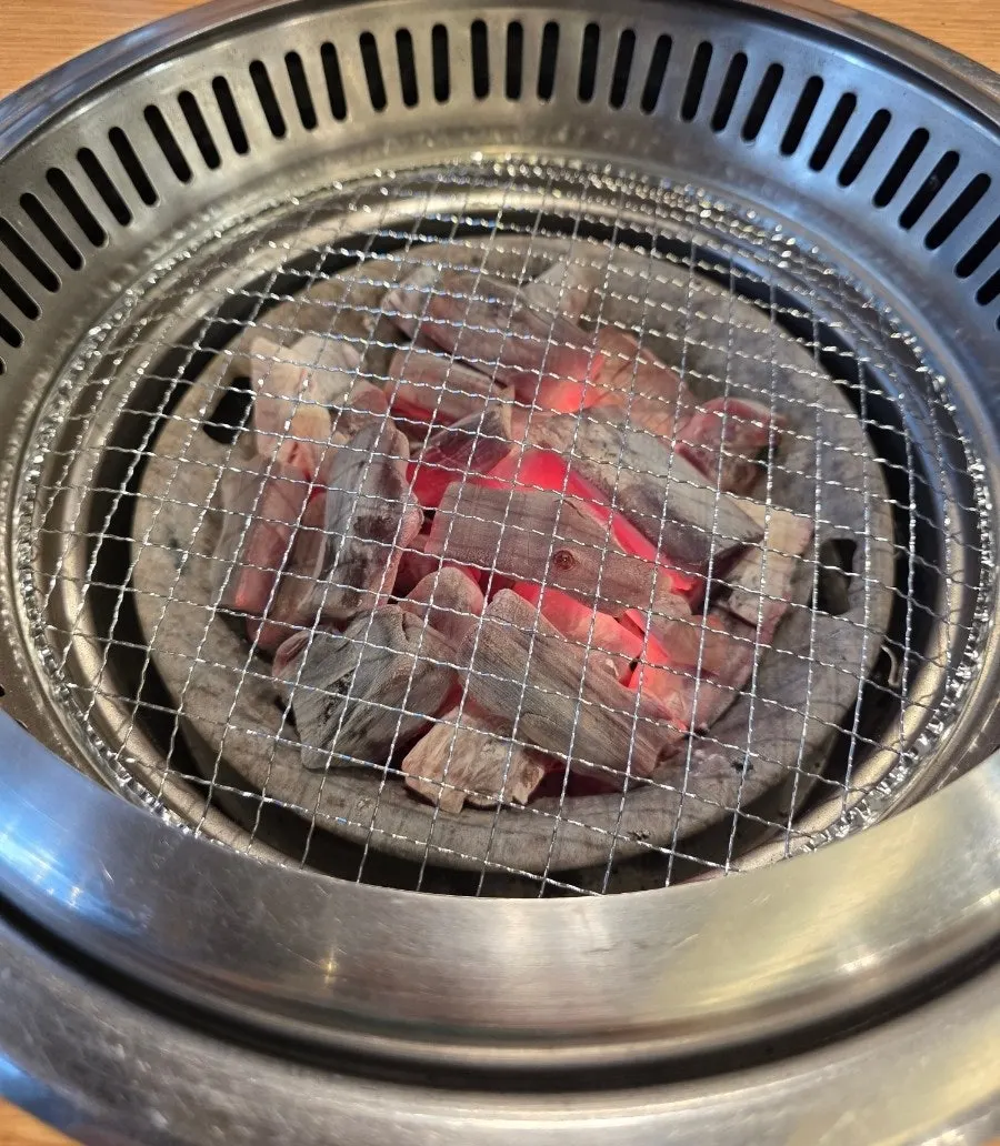 Lit charcoal brazier on the table