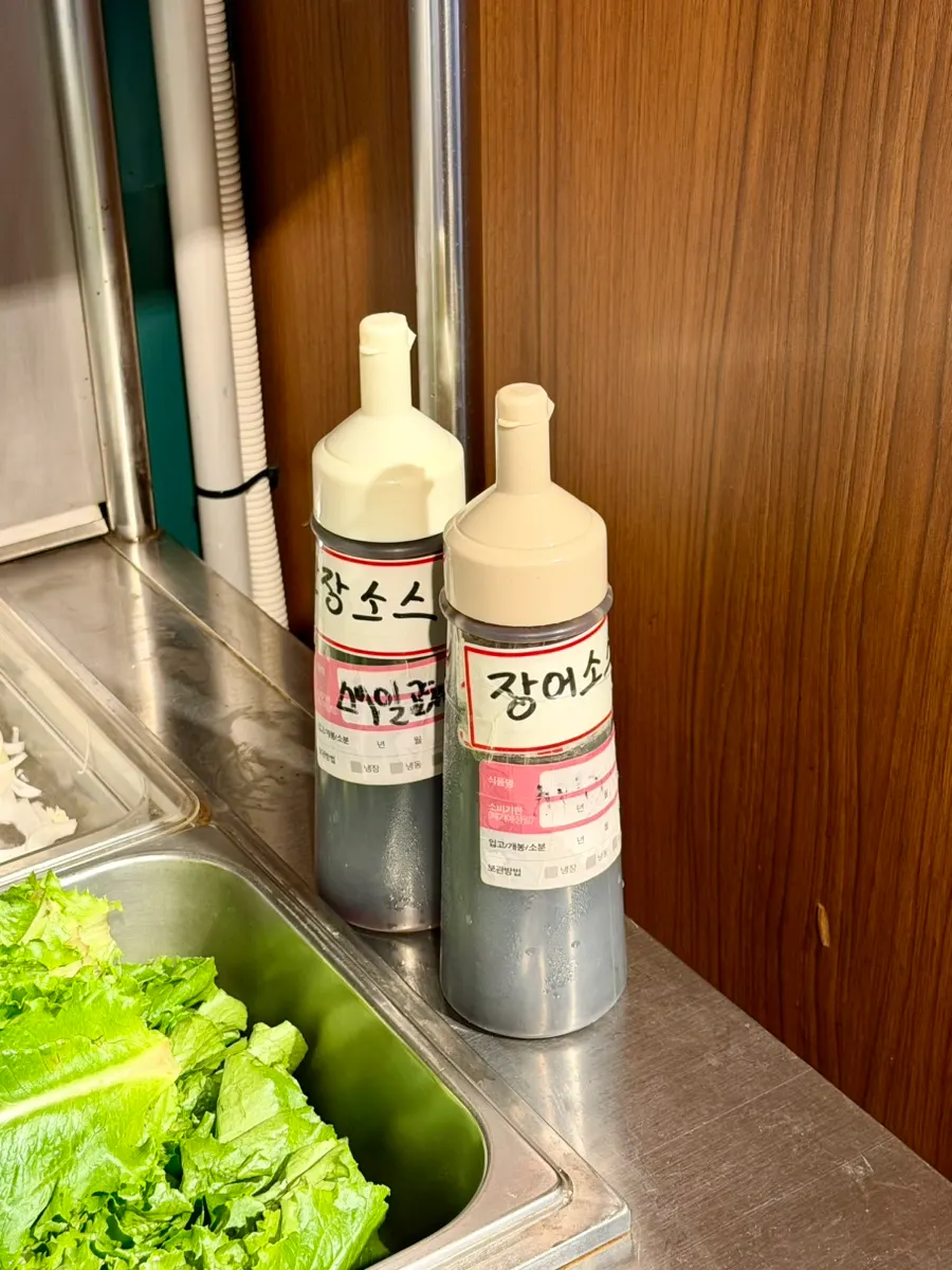 Self-serve corner with kimchi and side dishes