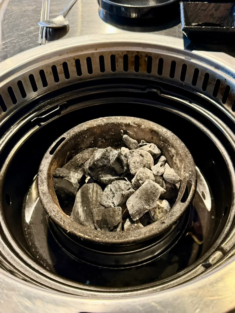 Charcoal grill set up at the table