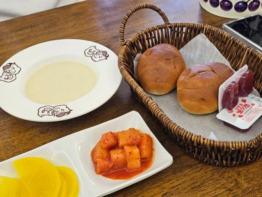 Morning rolls, strawberry jam, and cream soup
