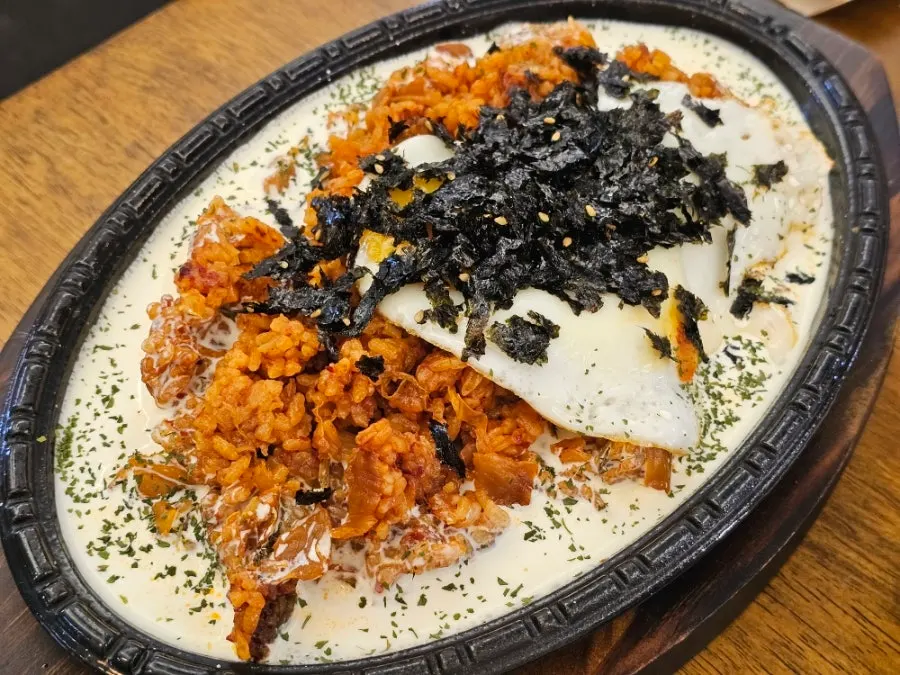 Cream kimchi fried rice on a hot plate