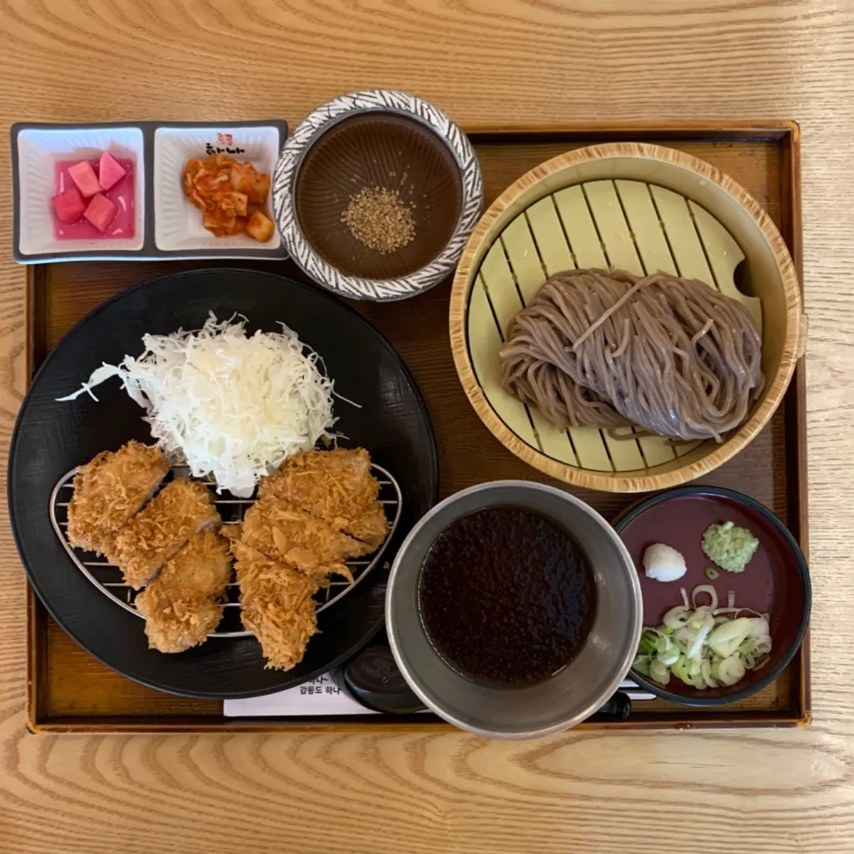 Table spread with tenderloin cutlet and soba set
